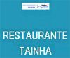 Placa do restaurante Tainha: fundo azul com texto branco e logotipo de peixe.