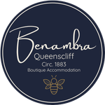 Logo for Benambra, Queenscliff boutique accommodation. Navy blue circle with white script 
