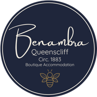 Logo for Benambra, Queenscliff boutique accommodation. Navy blue circle with white script 