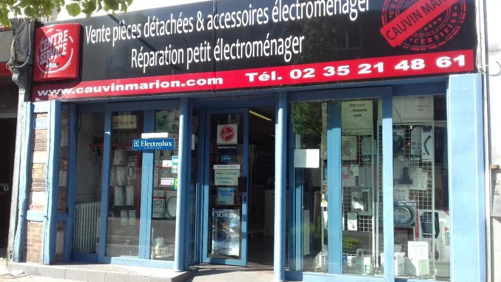 Un magasin avec une enseigne en français proposant des pièces détachées, des accessoires et des services de réparation pour appareils électroménagers.