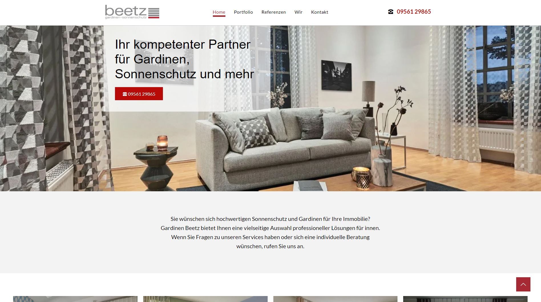 Homepage mit einer Wohnzimmerszene mit Vorhängen und einem Sofa.