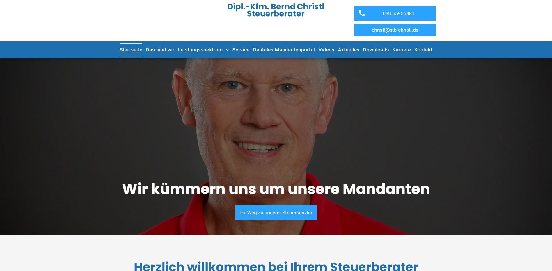 Smiling man in a red shirt. Text: