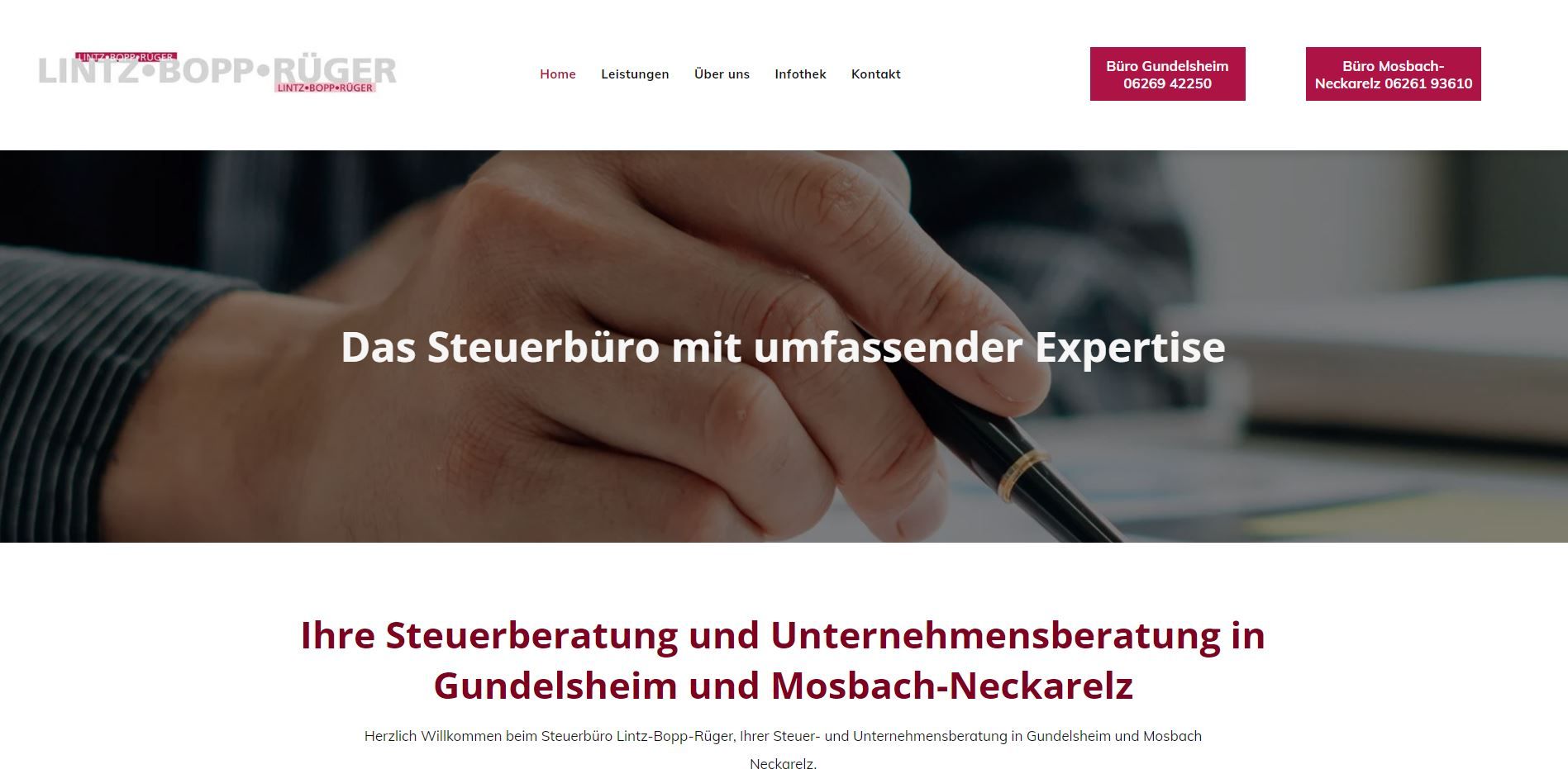 A hand holding a pen above a document, with the text