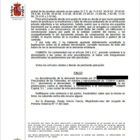 Carta legal española escaneada en papel con membrete oficial, sello rojo y datos personales tachados.