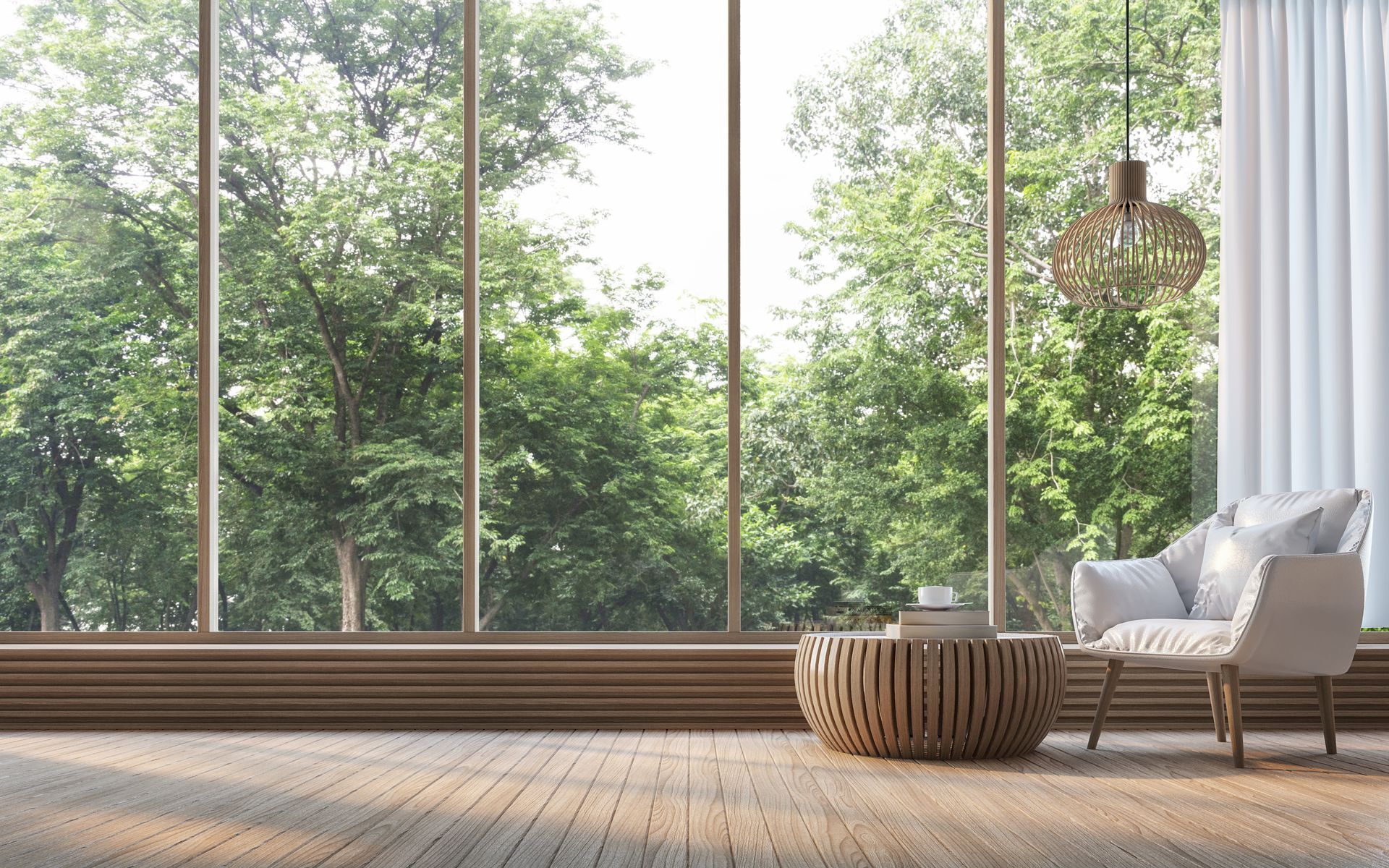 Une baie vitrée avec des arbres.