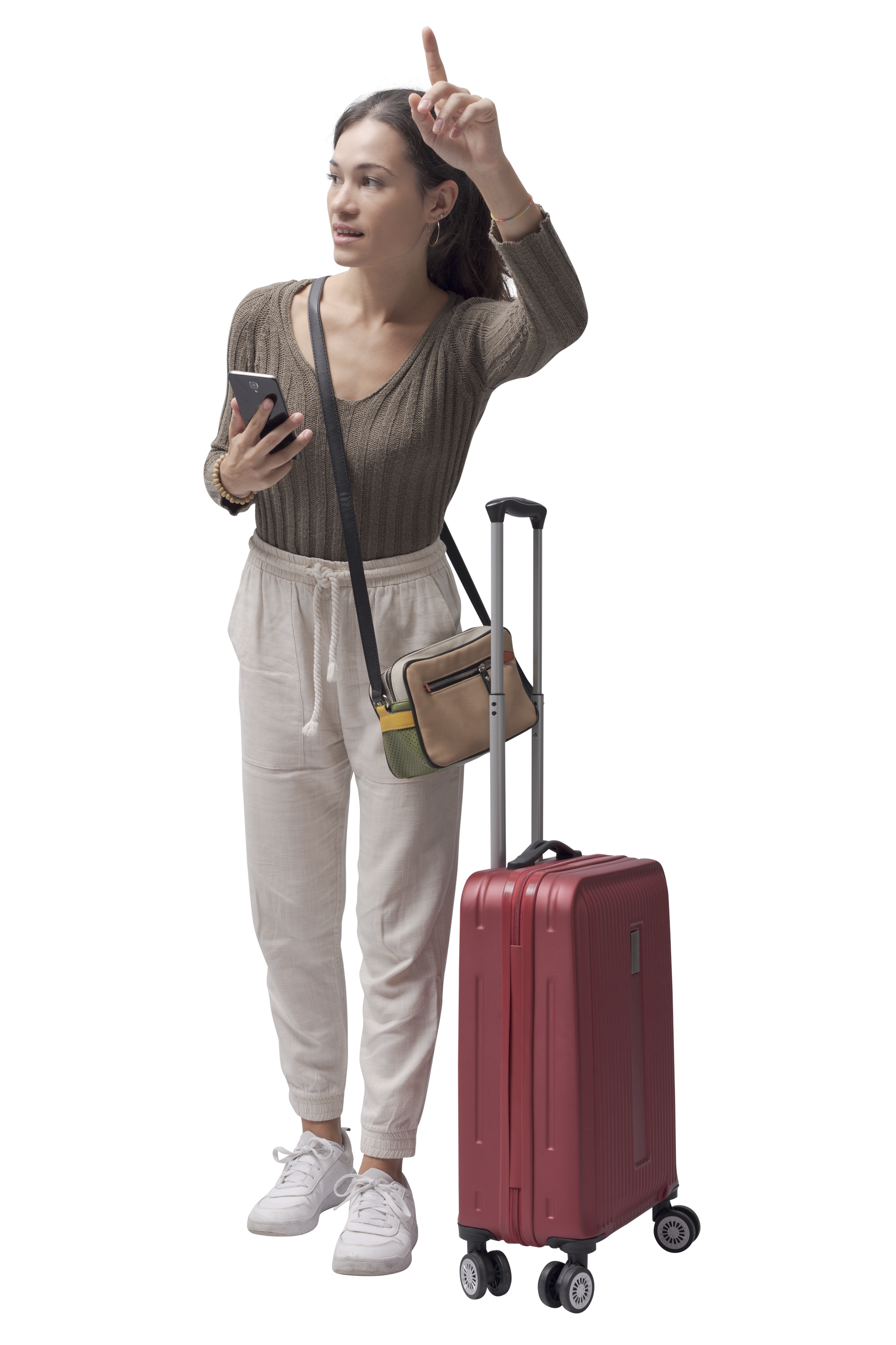 Une femme avec une valise hèle un taxi