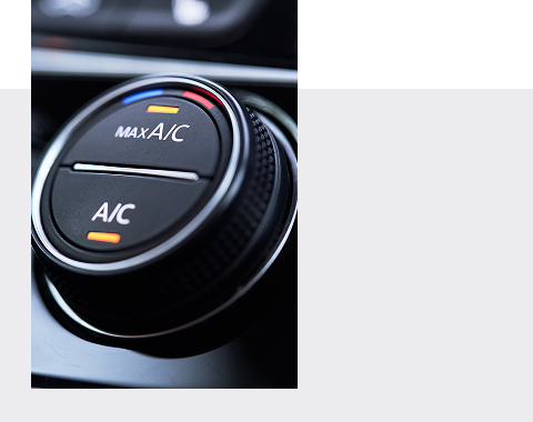 Bouton de l'air conditionné d'un véhicule.