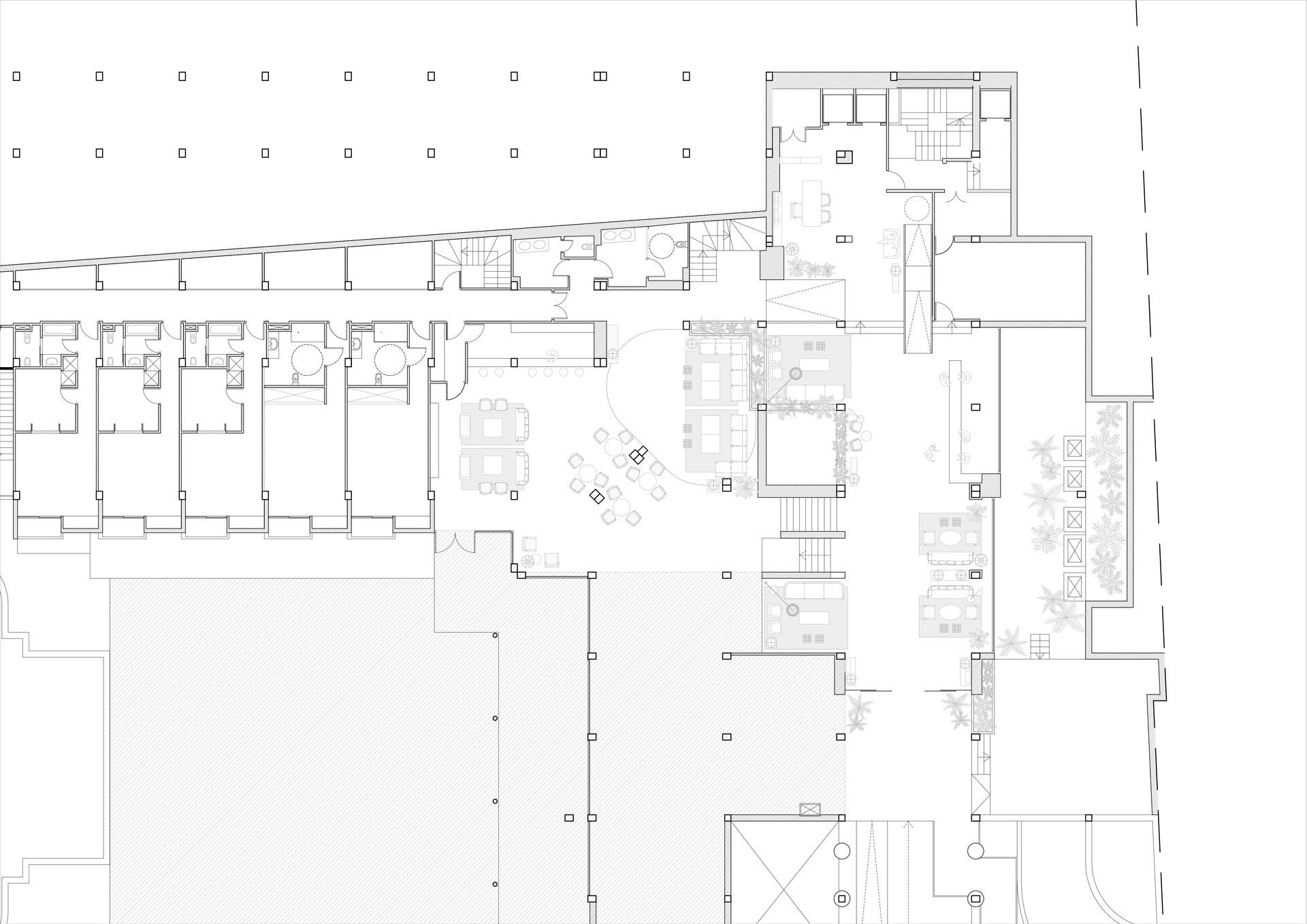 Plano arquitectónico en blanco y negro con habitaciones, pasillos y zonas sombreadas.