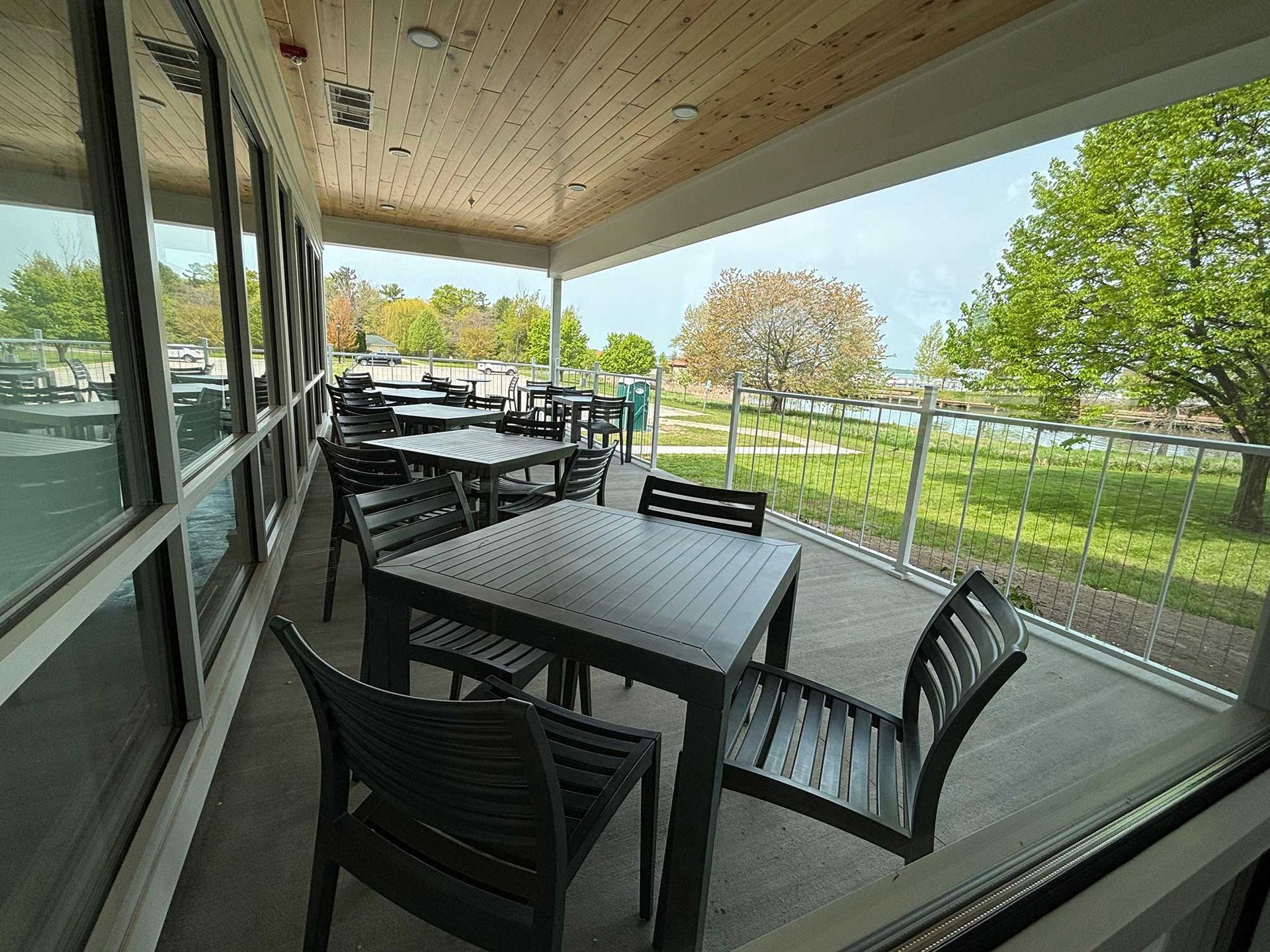 Patio view with tables and chairs.