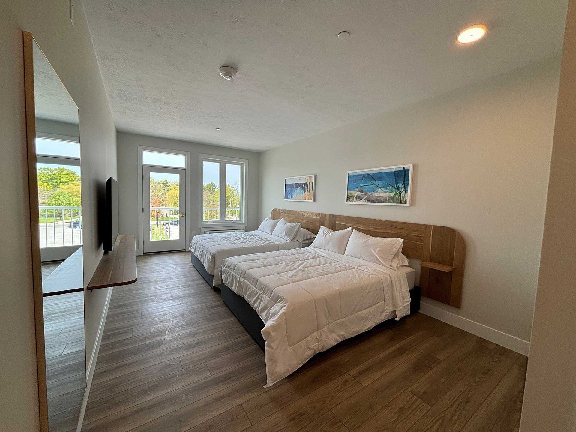 Two queen beds in a room.