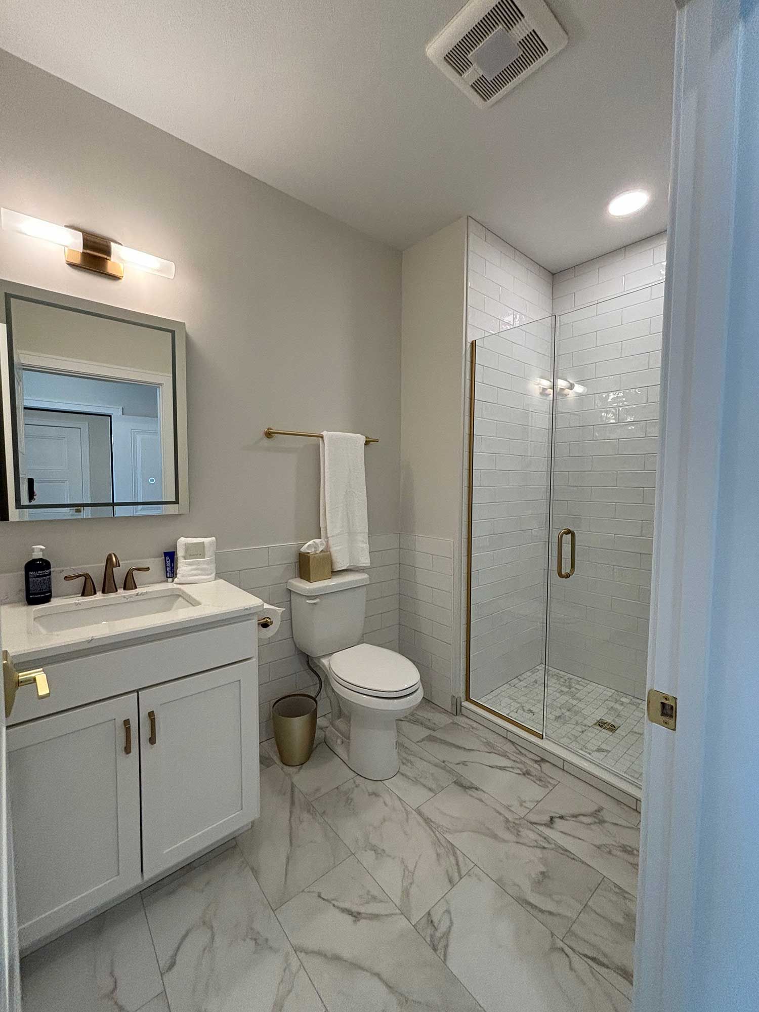 Bathroom with walk-in shower.