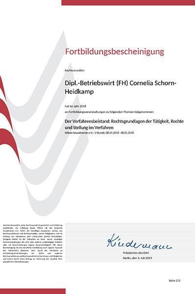 Eine weiß-rote Urkunde mit einer Unterschrift darauf.