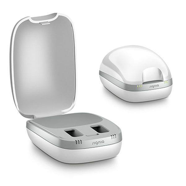 ein signia Ladegerät , das auf einem weißen Hintergrund sitzt