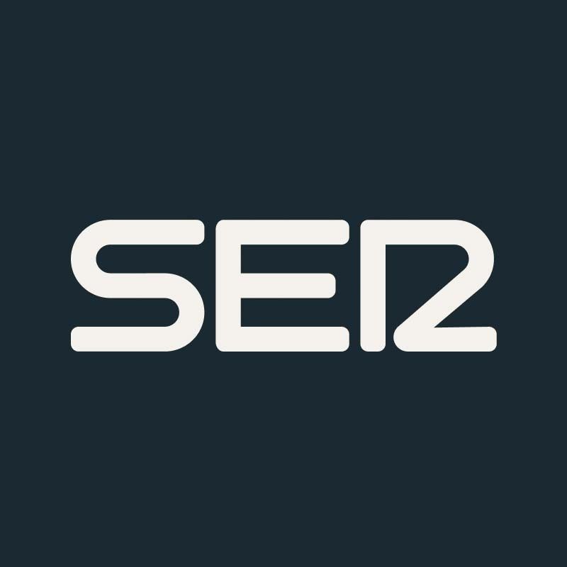 Logotipo blanco “SE2” sobre fondo azul oscuro.