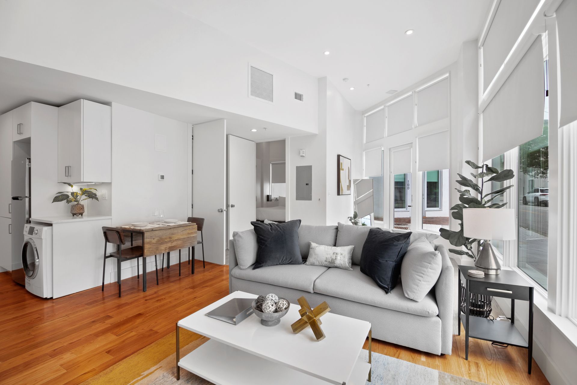 a lounge setting with wooden flooring