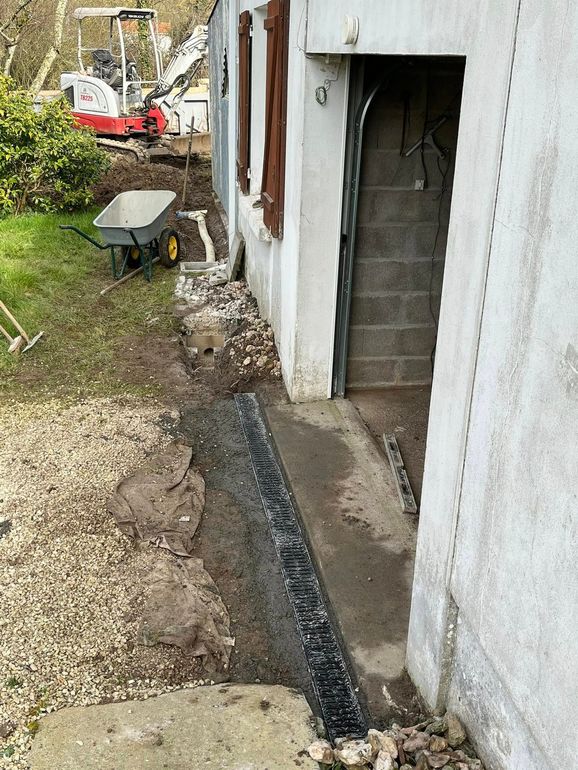 Dispositif de drainage devant la sortie d'un garage