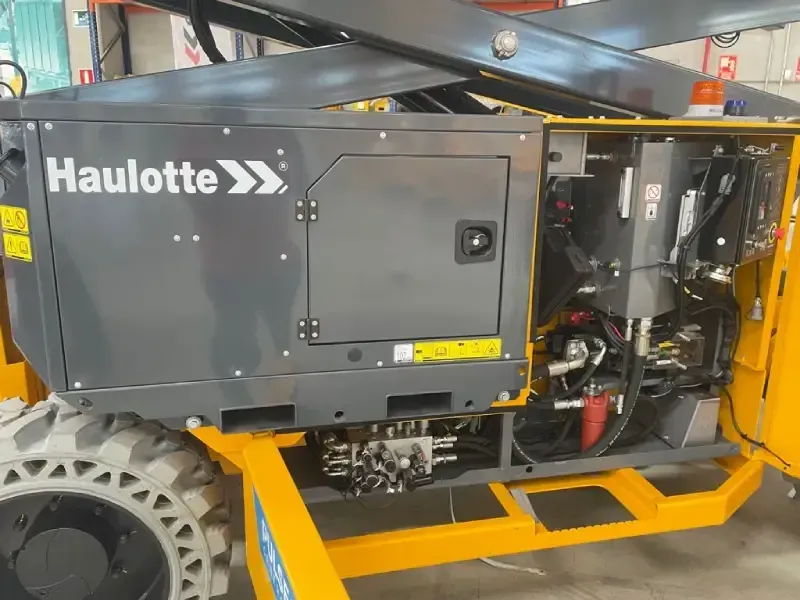 Una máquina amarilla y gris con la palabra haulotte escrita en ella.