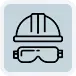 Un icono de casco y gafas protectoras sobre un fondo azul.