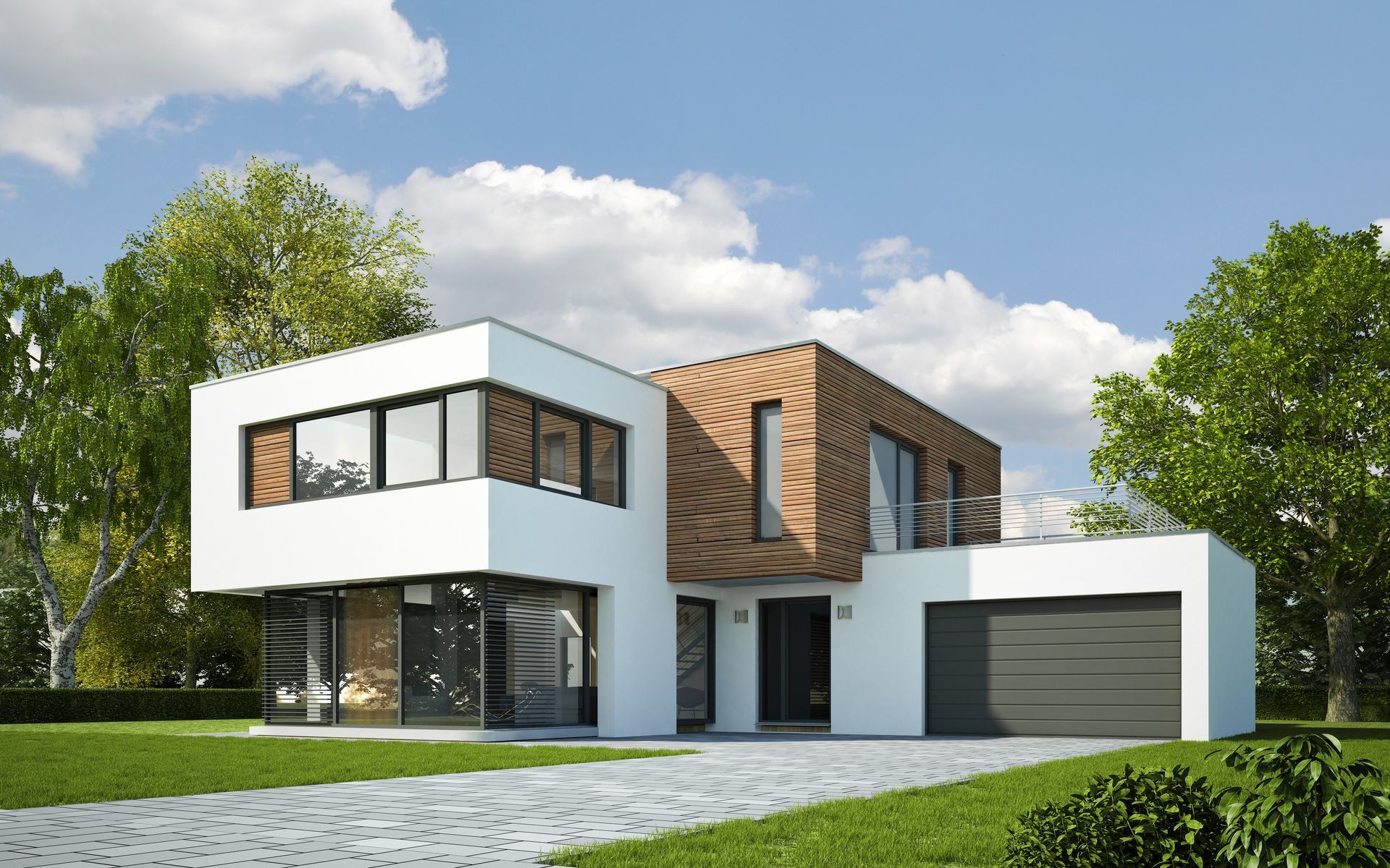 Maison blanche moderne de deux étages avec des éléments en bois, de grandes fenêtres et un garage sur une pelouse verte sous un ciel bleu.