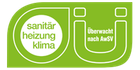 Ein grünes Schild mit der Aufschrift „Sanitar Heizung Klima“