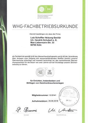 Eine Bescheinigung mit grünem Hintergrund und einer Unterschrift darauf.