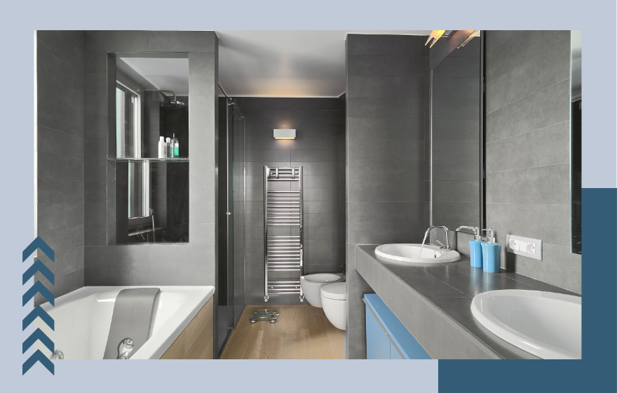 Un baño con dos lavabos, dos inodoros y una bañera.