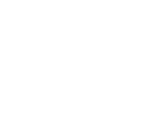 Unité de climatisation extérieure Daikin, couleur beige clair avec grille métallique, installée à l'extérieur.