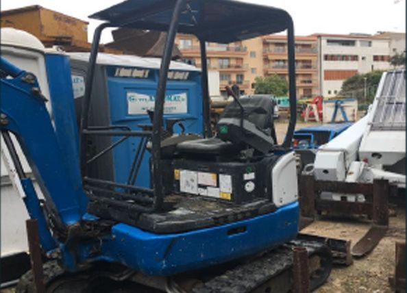 Pelleteuse chargée sur une remorque