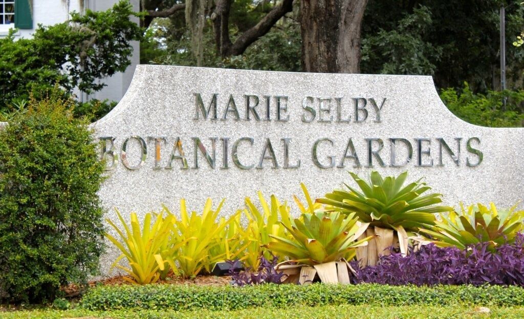 Marie Selby Botanical Gardens sign with lush plantings.