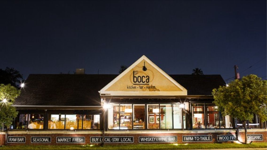 A brightly lit restaurant building with a 