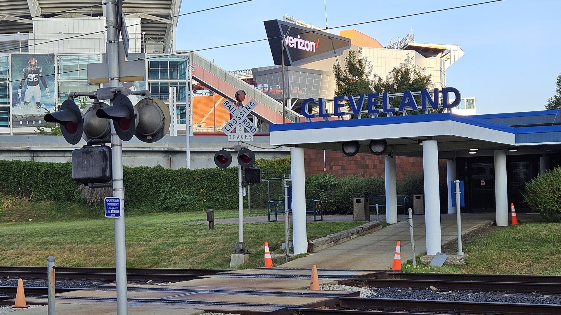 Cleveland train station with stadium in background; train tracks in foreground.