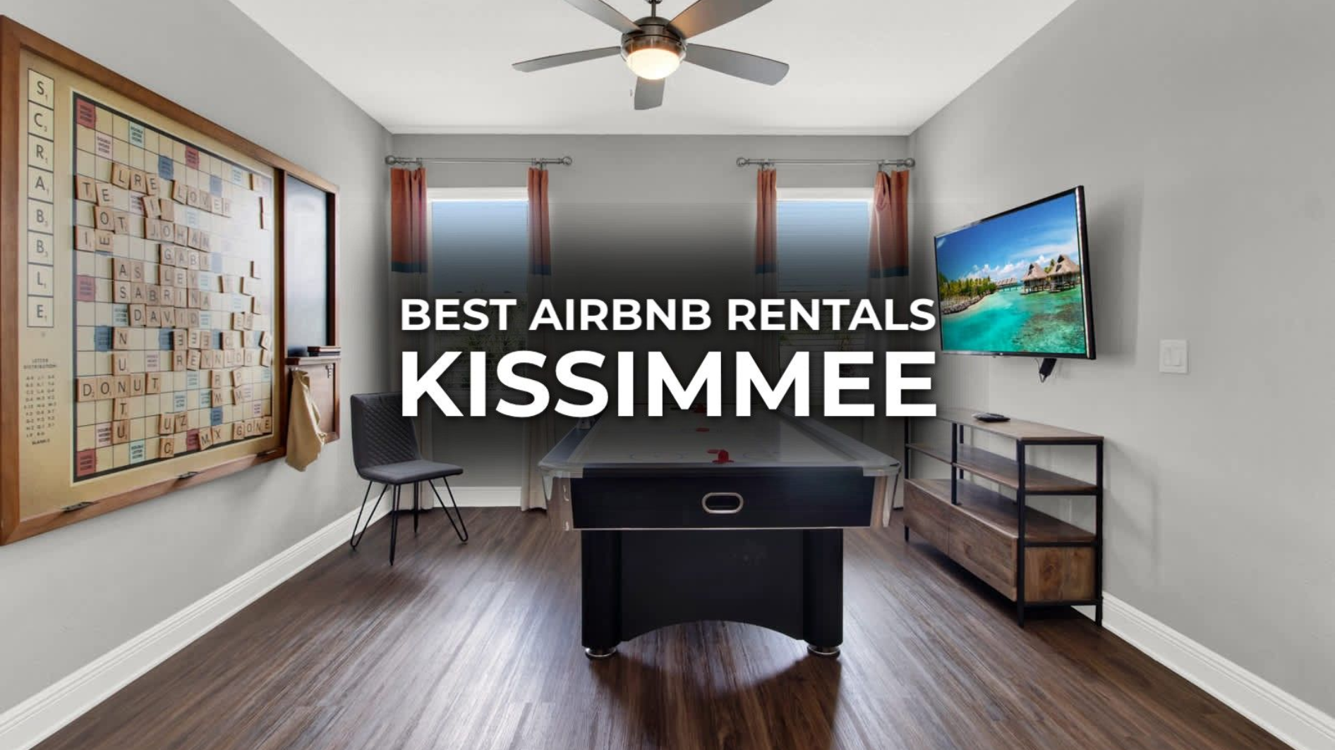 Game room in a Kissimmee Airbnb with foosball, TV, artwork, and windows.