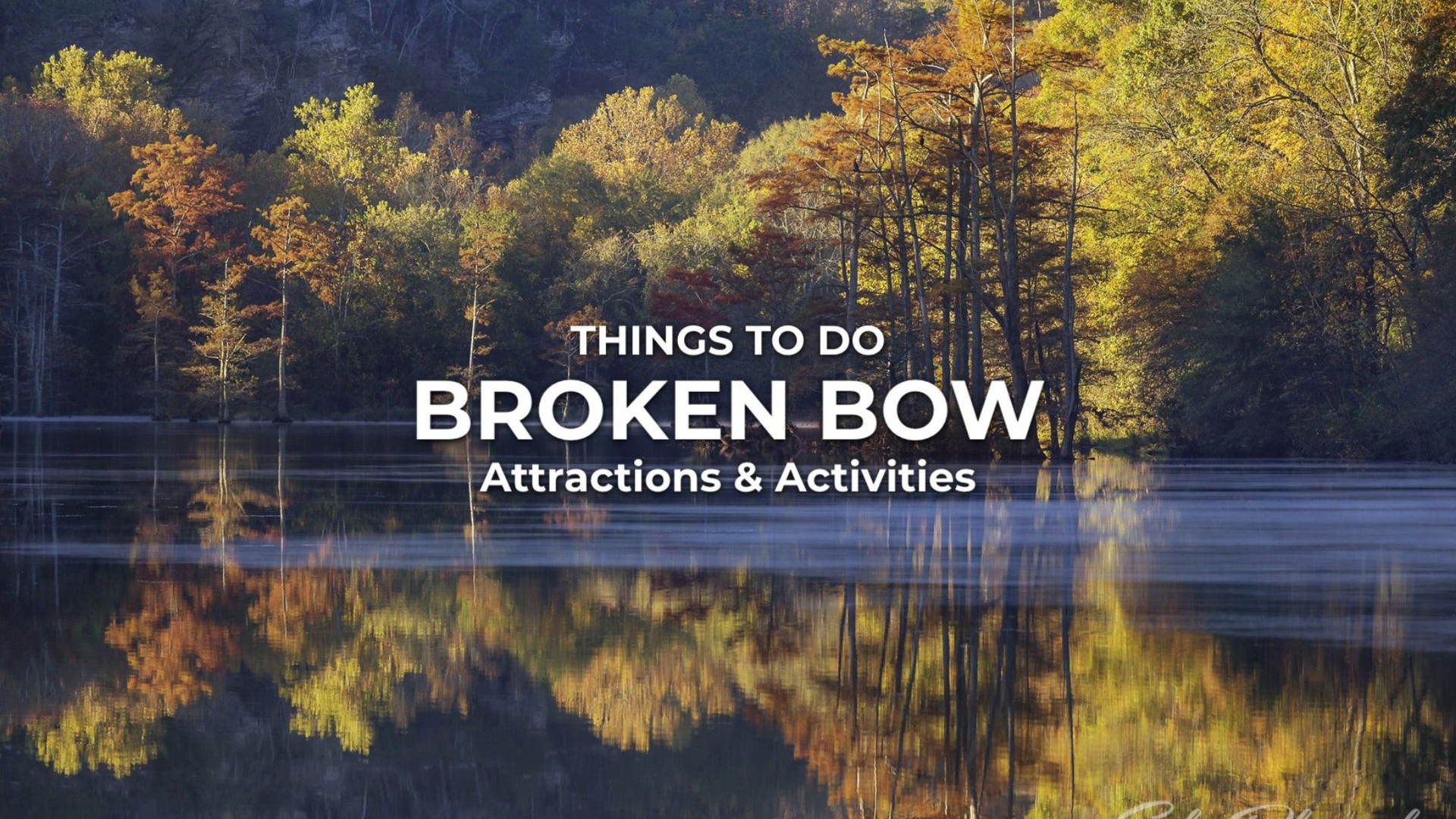 Broken Bow: Lake with trees reflecting in the water; text overlay