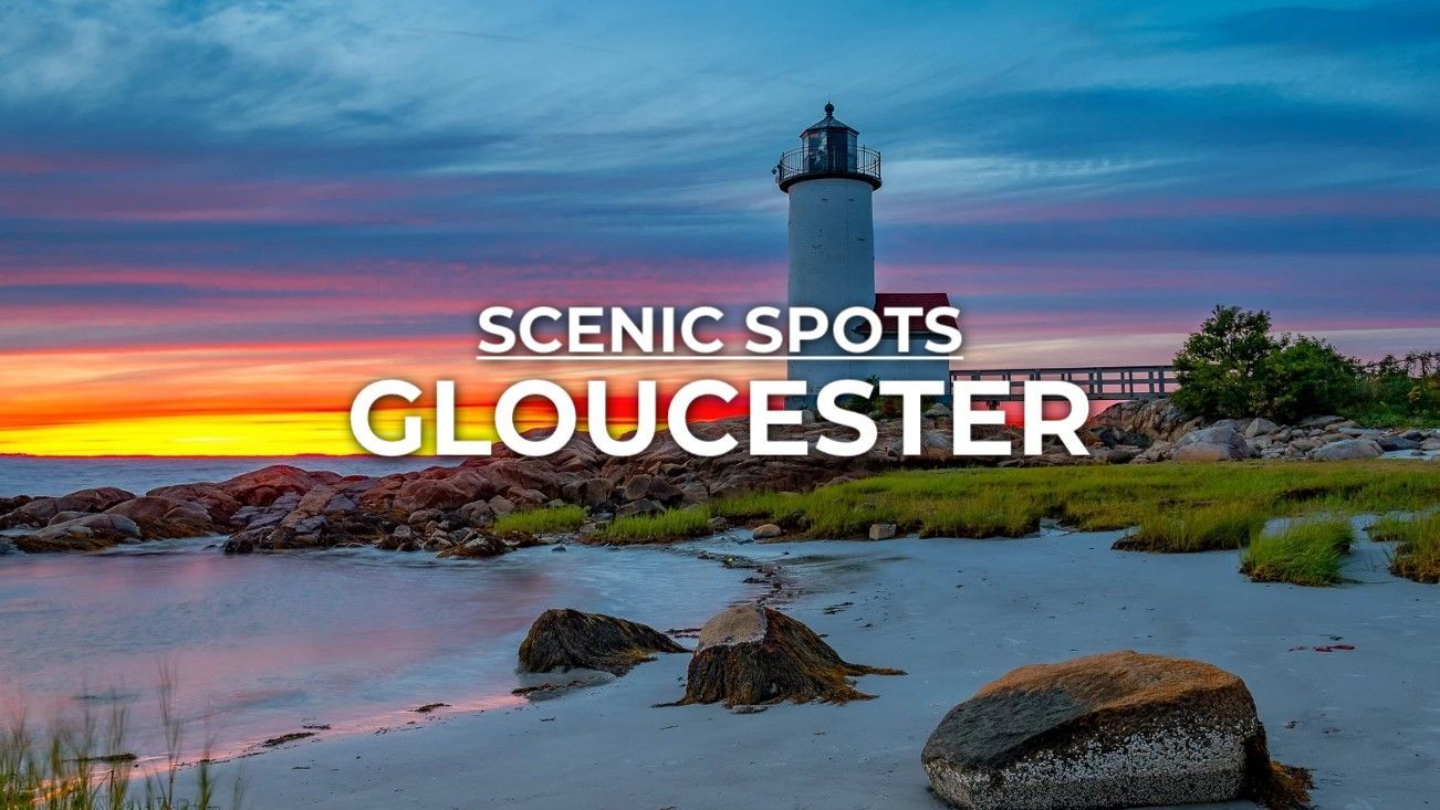 Lighthouse at sunset on a rocky beach in Gloucester, Massachusetts.
