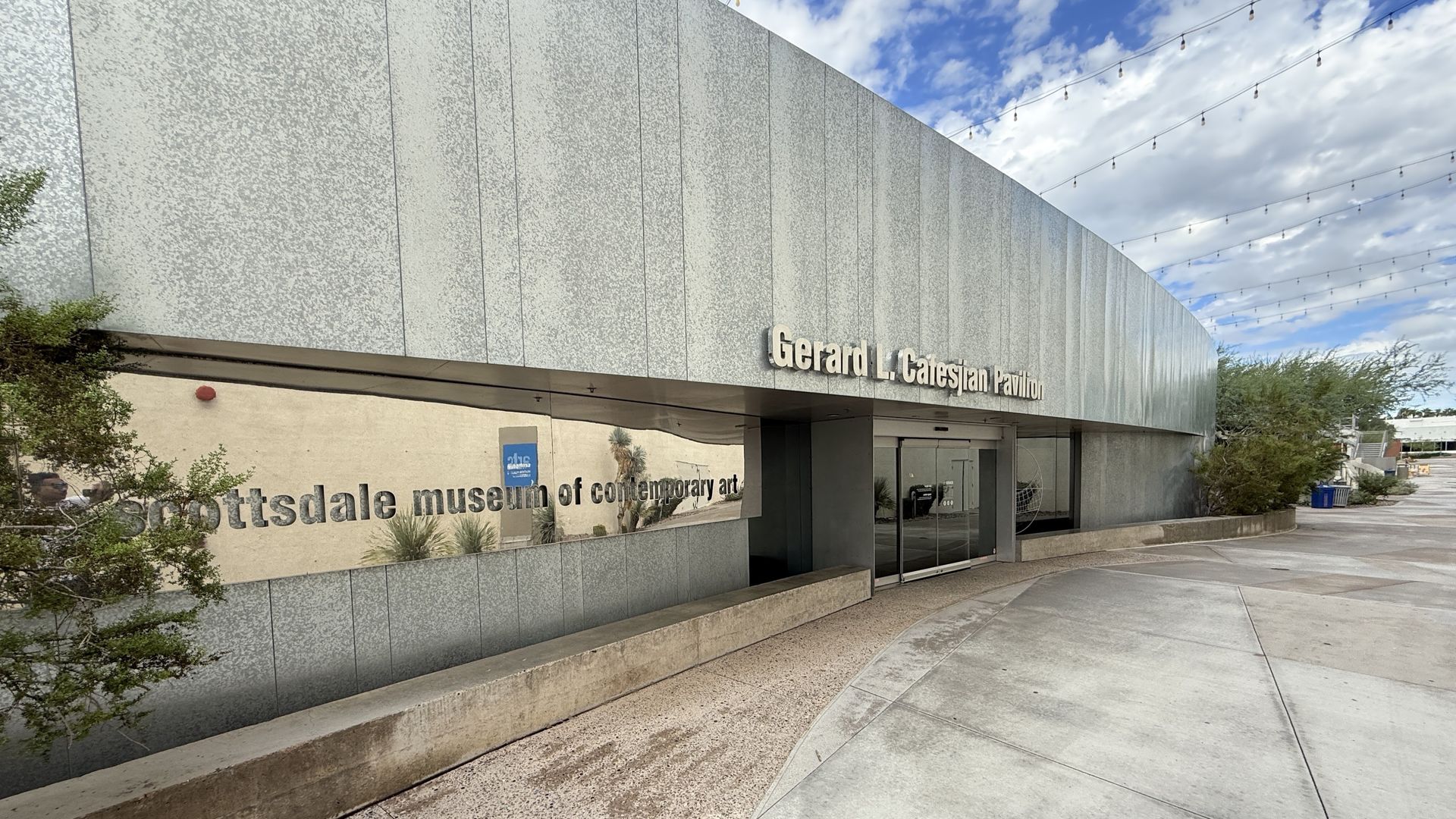 Scottsdale Museum of Contemporary Art building with a ramp, entrance, and cloudy sky.