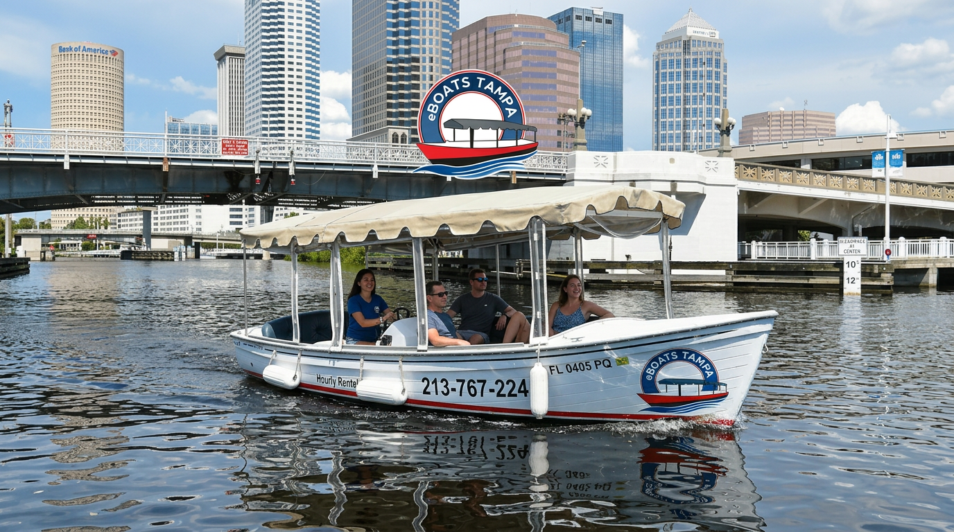 Small white passenger boat on a river with city buildings and a bridge in the background