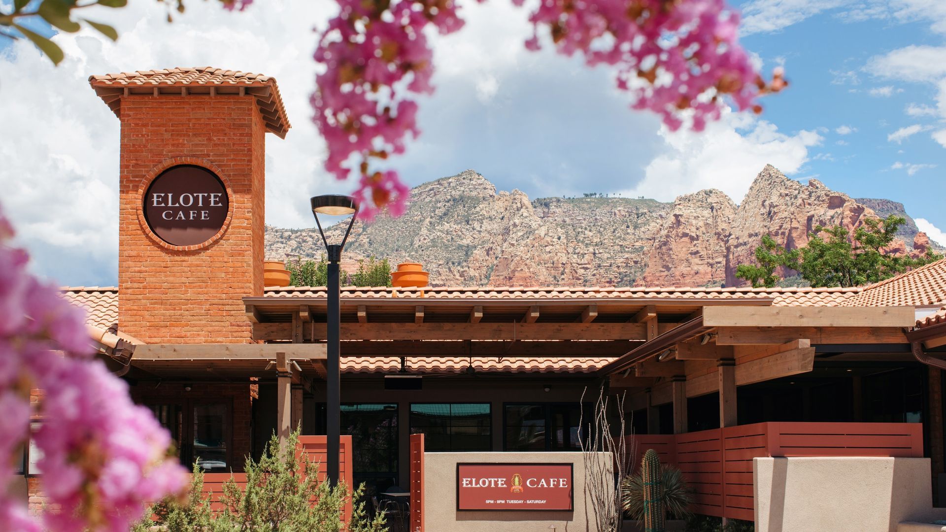 Restaurant with red brick facade, sign 