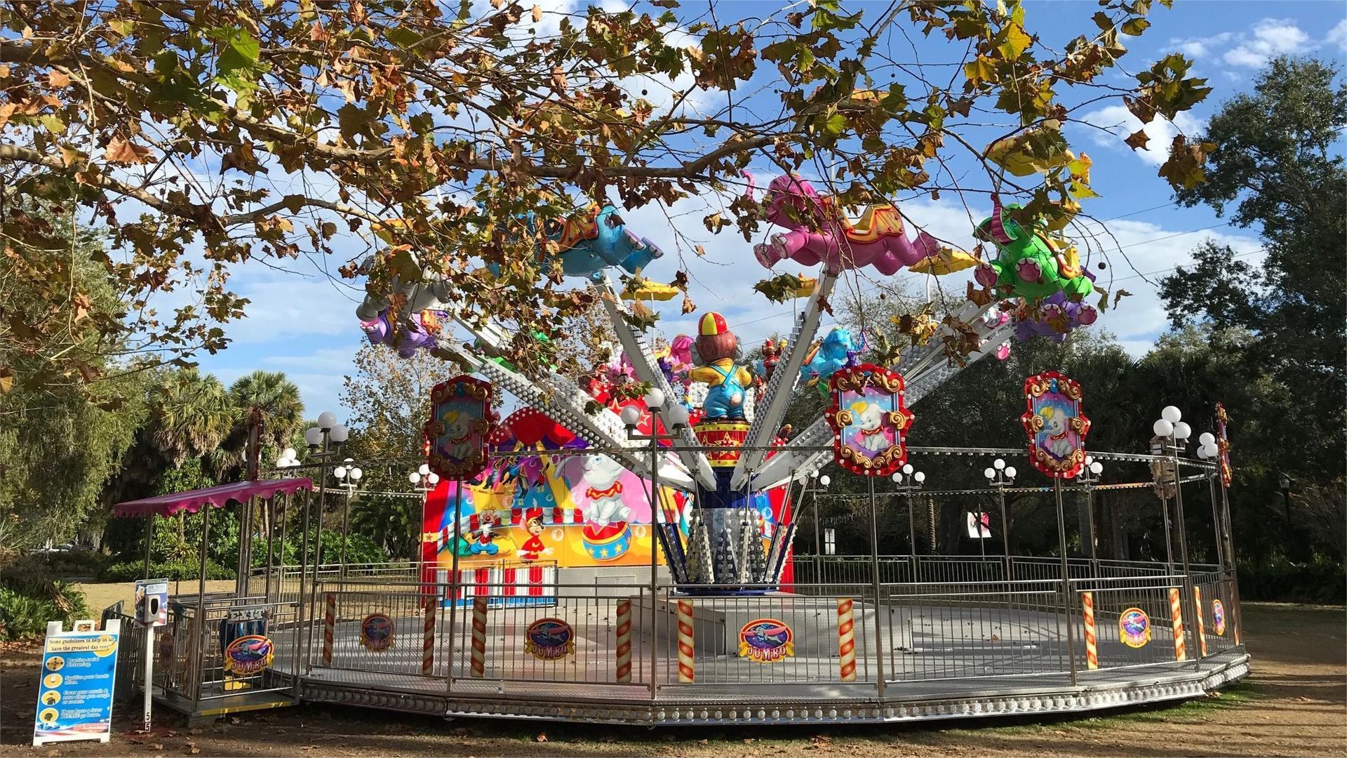 Amusement park ride with colorful decorations, outdoors.