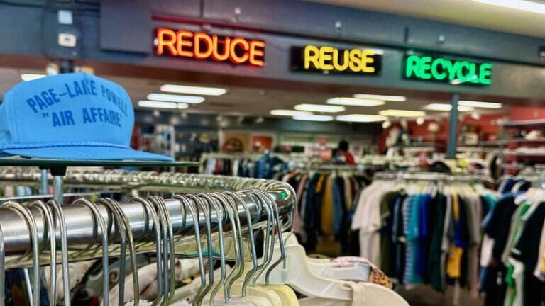 Thrift store interior with clothes racks and