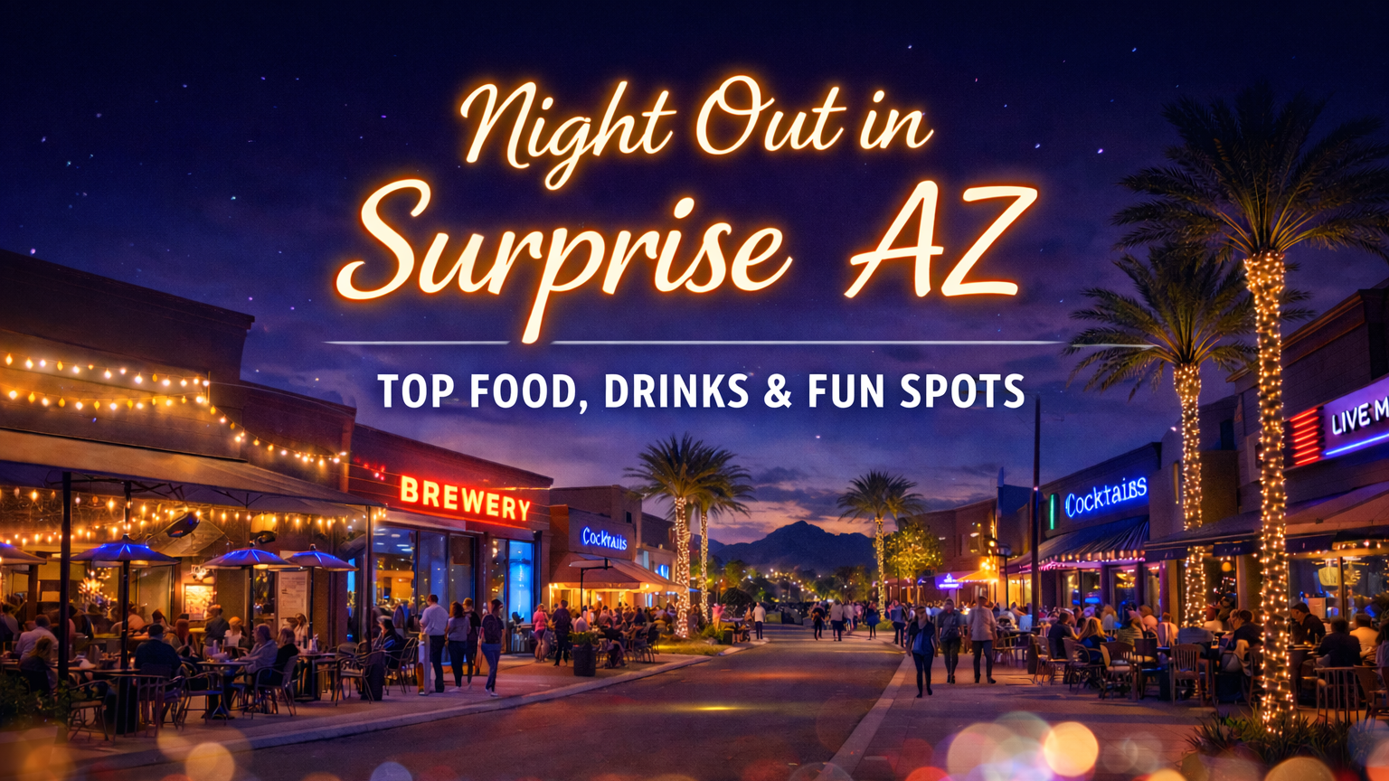 Nighttime street in Surprise, Arizona, with restaurants, string lights, and palm trees.