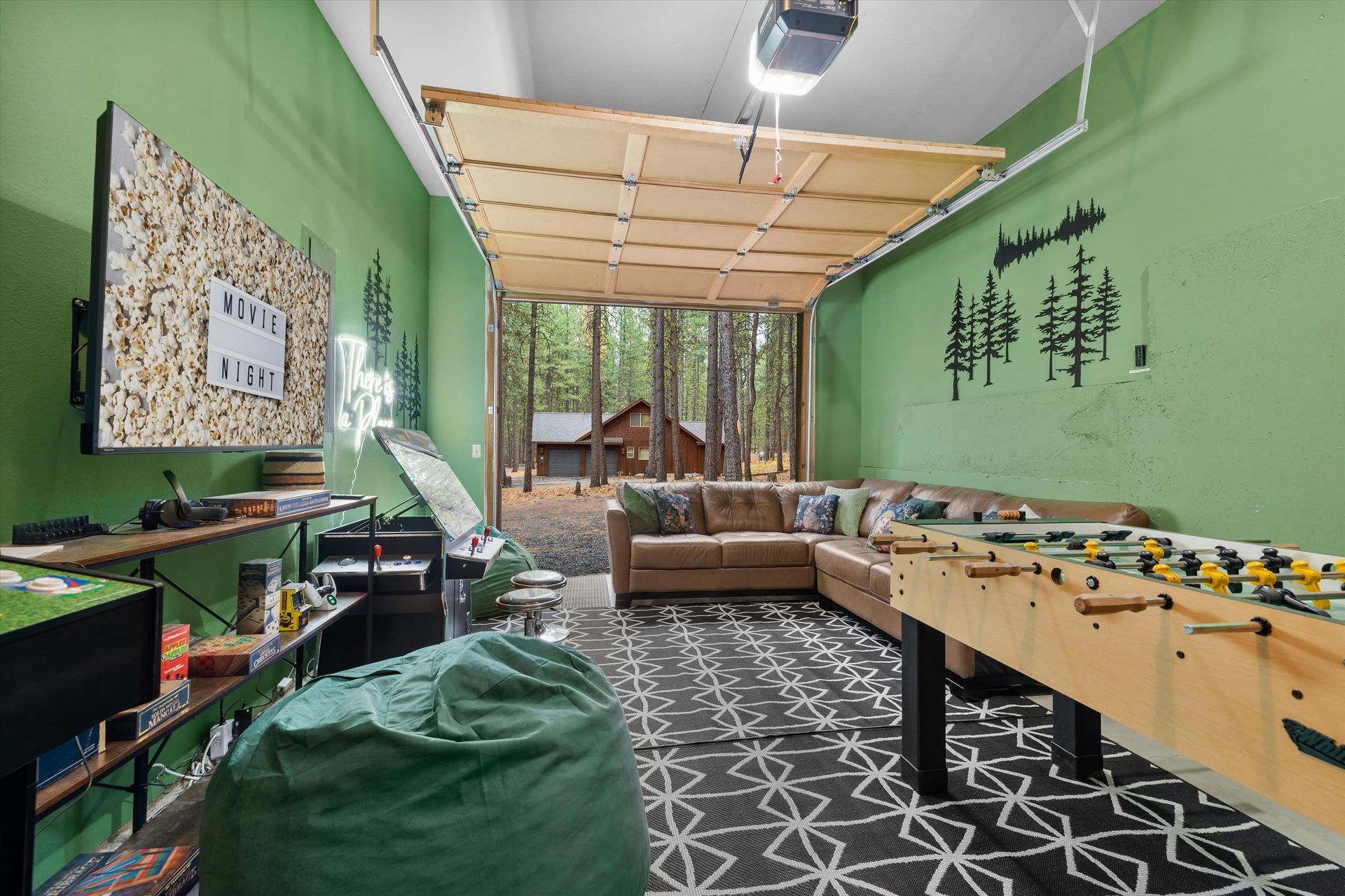 Cozy game room with foosball table, pool table, bean bag chair, and green walls