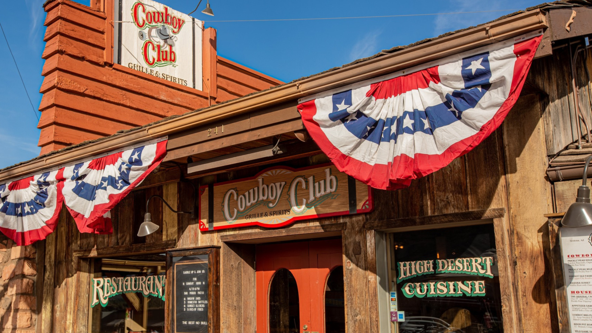 The Cowboy Club restaurant entrance with red, white, and blue bunting.
