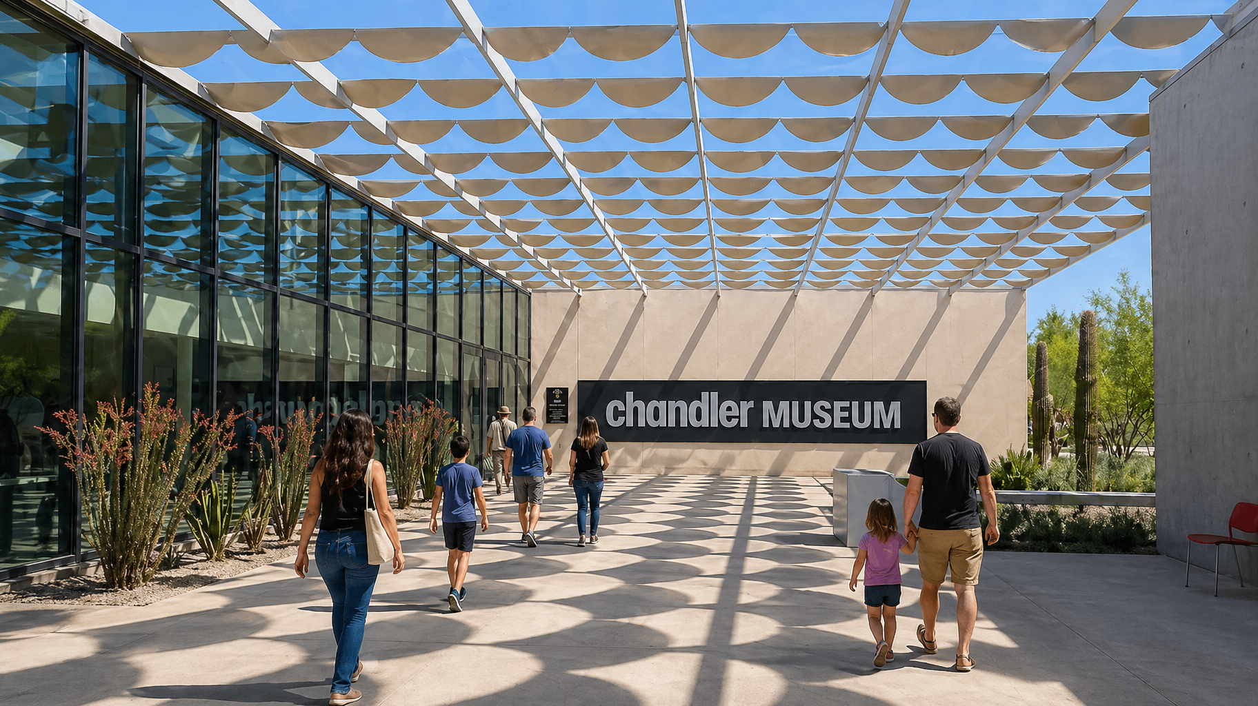 People walking toward Chandler Museum under a patterned canopy on a sunny day