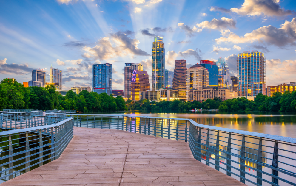 A dock overlooking a lake with a city skyline in the background in Austin, Texas