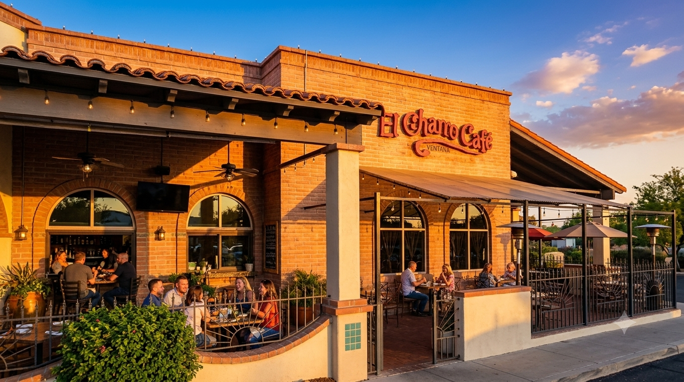Sunset exterior of a Spanish-style café with patio seating and warm orange stucco walls