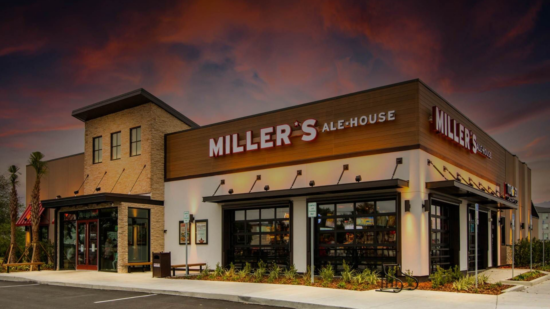 Miller's Ale House restaurant building with exterior signage under a sunset sky.