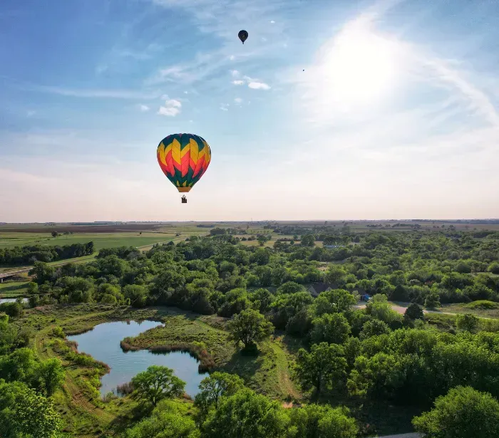 hot air balloon ride above Kansas forest