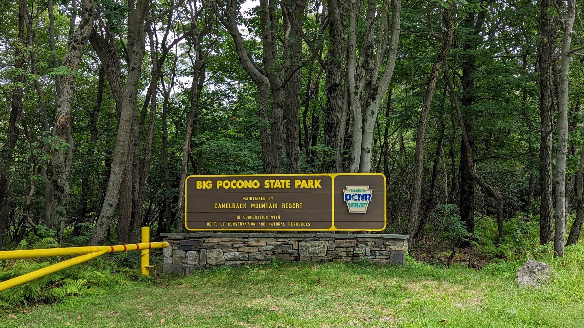 Sign for Big Pocono State Park, brown and gold, with trees in the background.