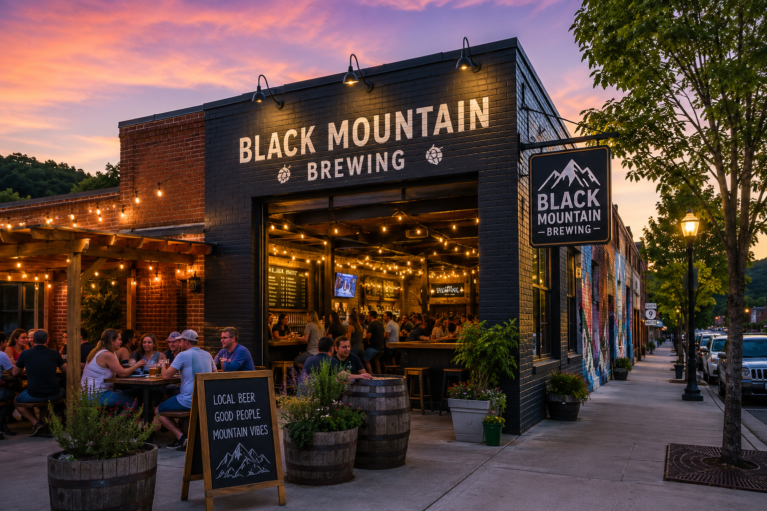 Black Mountain Brewing storefront at dusk with warm lights, outdoor seating, and a sunset sky