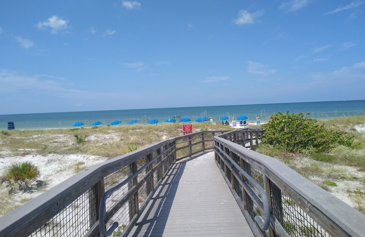 View of walking up to the beach access on Caladesi Island, on a cement pathway